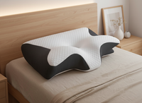 Oreiller ergonomique noir lit